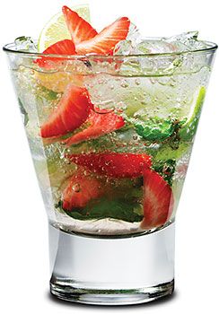 a glass filled with ice and strawberries