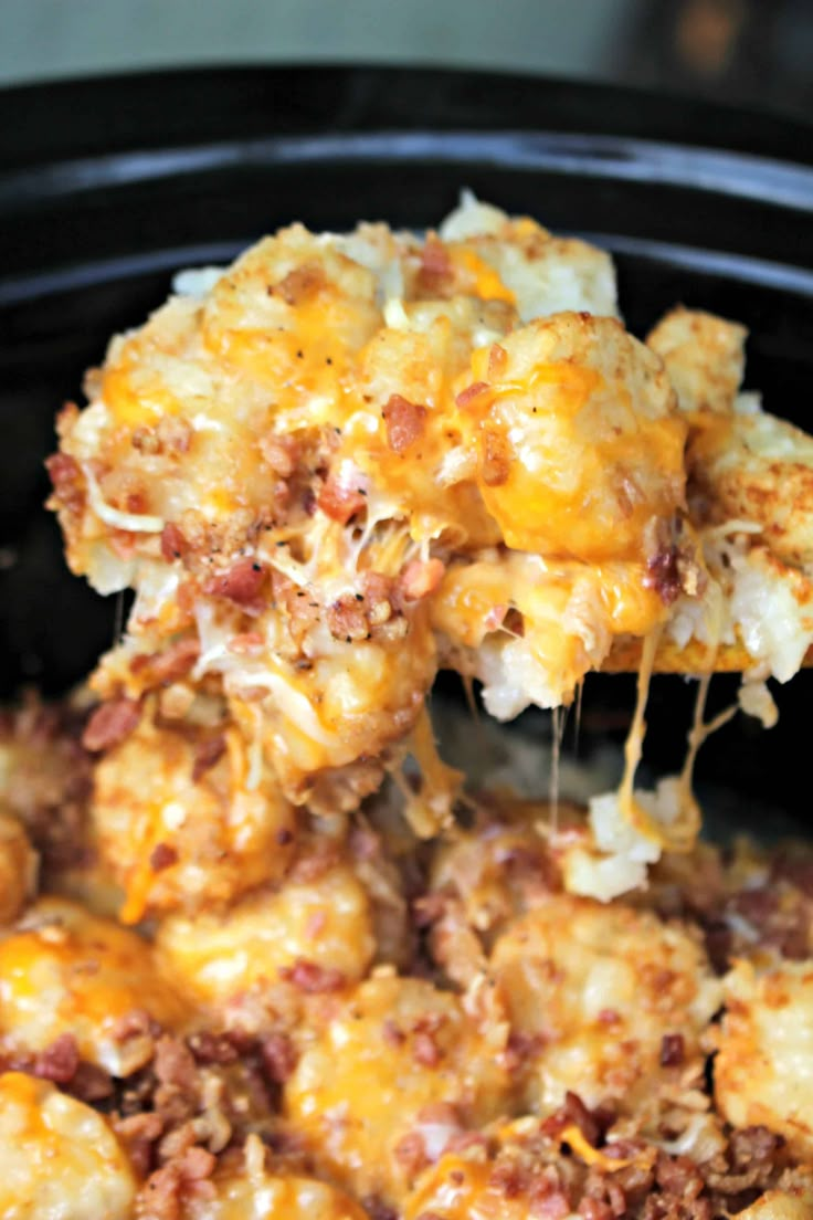 a crock pot filled with cheesy tater tot casserole