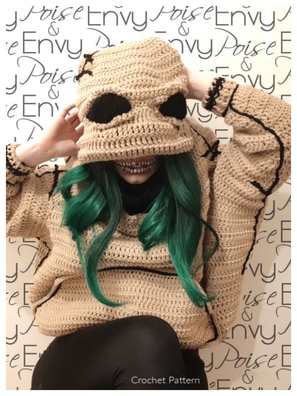 a woman with green hair wearing a knitted hat