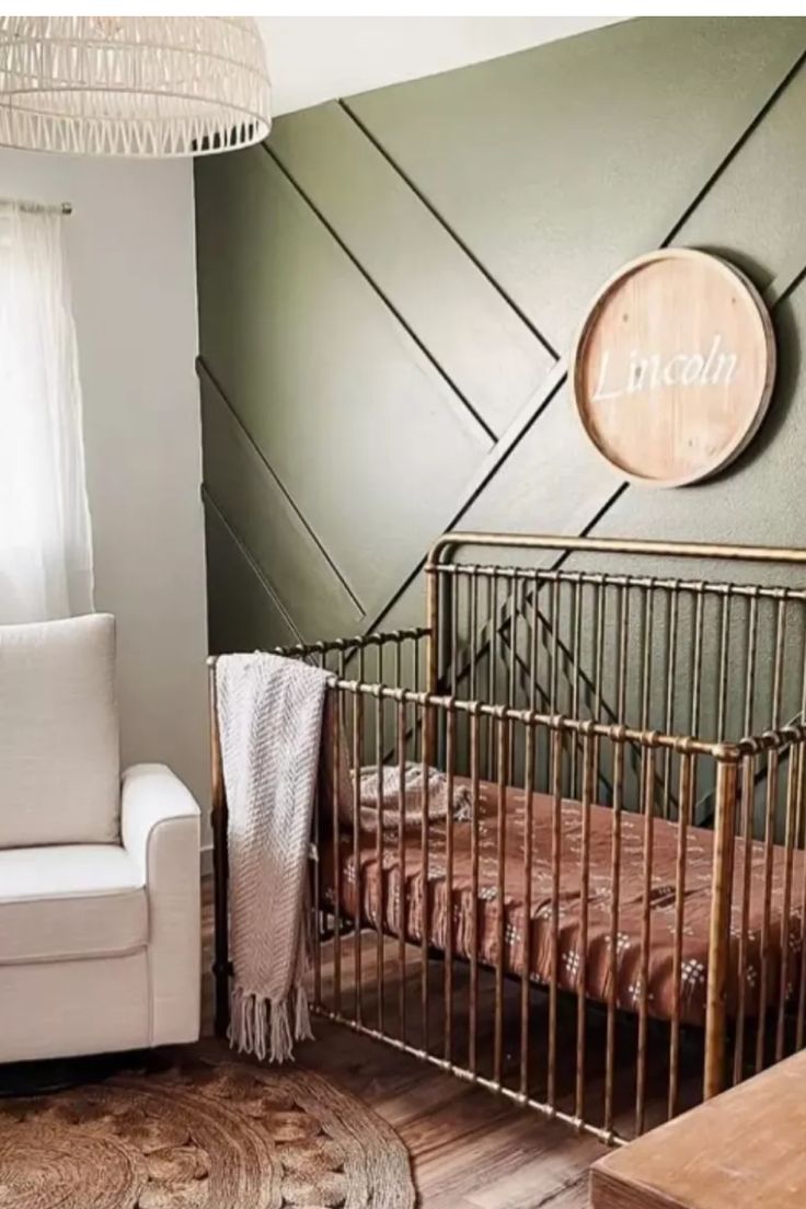 a baby's room with a crib and chair