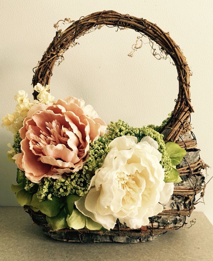 a basket filled with flowers sitting on top of a table