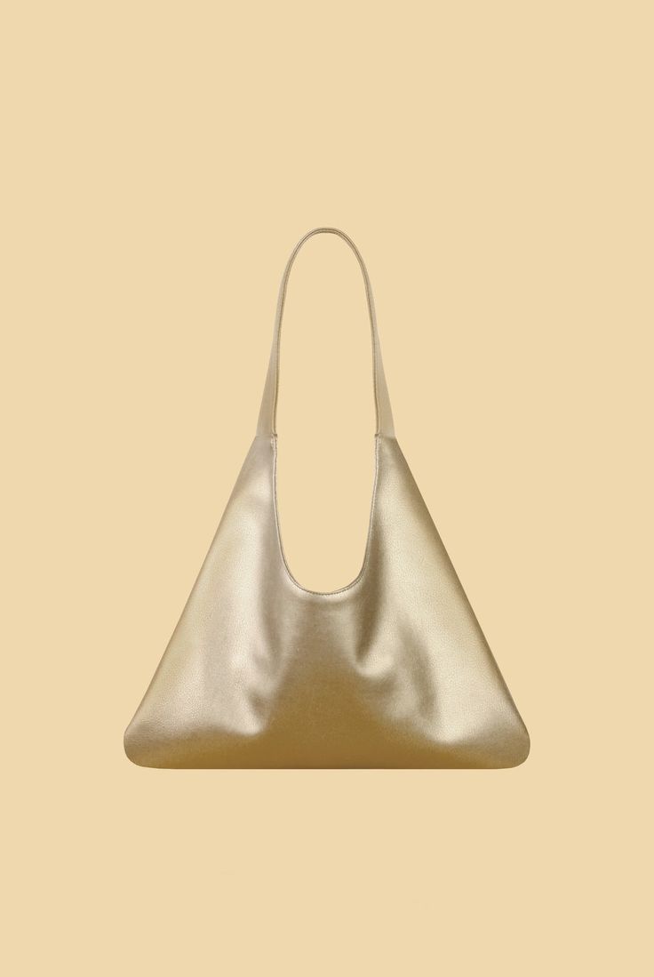 Agave Triangular Tote | Metallic Gold Funky Vibes, Embossed Logo, Elevate Your Style, Leather Handbag, Casual Jeans, Metallic Gold, Magnetic Closure, Tote Handbags, Laptop Bag