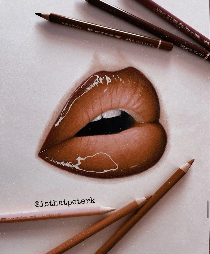 a drawing of a woman's lips with pencils next to it