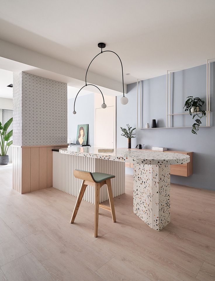 the modern kitchen is clean and ready to be used as a dining room or office