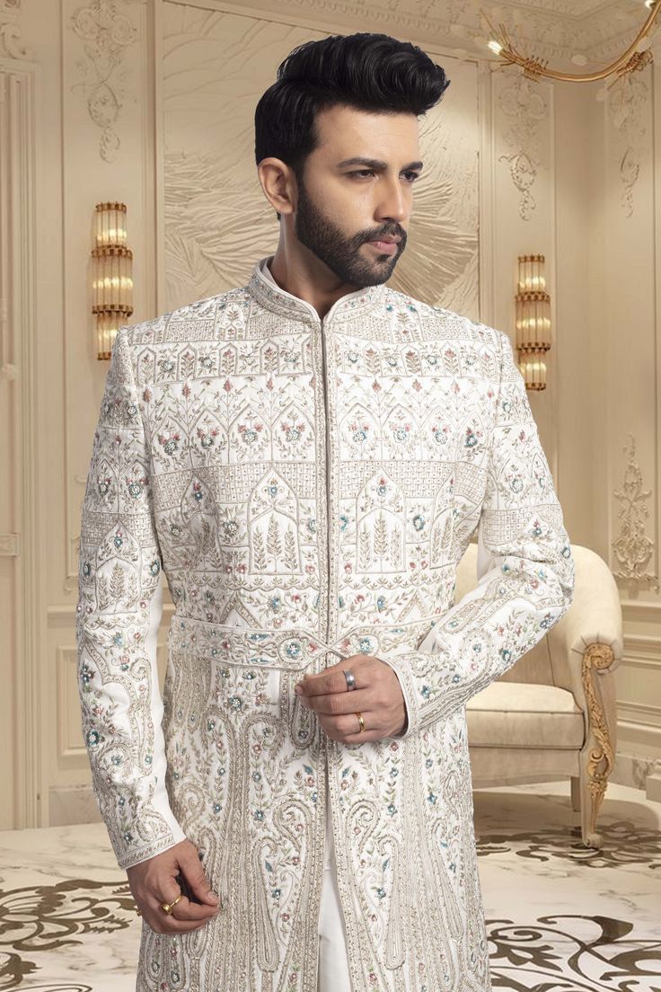 Crafted with intricate pearls and thread embroidery, the Mens Sherwani- U2-S350 is an exquisite choice for grooms. Its elegant design exudes sophistication, making it perfect for weddings. Elevate your wedding ensemble with this impeccable piece. Eid Wedding Traditional Wear With Pearl Embroidery, Traditional Wear With Pearl Embroidery For Wedding Eid, Wedding Traditional Wear With Pearl Embroidery, Traditional Wear With Pearl Embroidery For Reception, Traditional Pearl Embroidery Wear For Reception, Reception Bandhgala With Intricate Embroidery, Traditional Drape Bandhgala With Intricate Embroidery For Reception, Elegant Traditional Wear With Intricate Design For Reception, Elegant Traditional Wear For Reception With Intricate Design