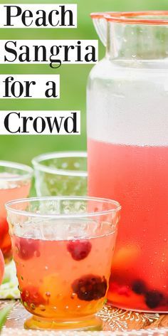 peach sangria for a crowd in front of pitcher and glasses filled with watermelon