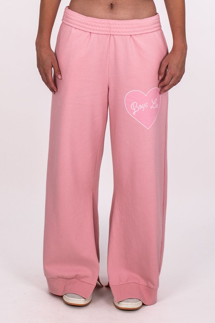 100% Cotton | Machine Wash Cold, Tumble Dry Low Model is 5'9 wearing size small Pink Pants With Elastic Waistband For Winter, Pink Cotton Sweatpants, Pink Cotton Sporty Sweatpants, Pink Full-length Loungewear Bottoms, Pink Athleisure Bottoms For Loungewear, Pink Casual Sweatpants For Winter, Casual Pink Cotton Sweatpants, Casual Pink Joggers For Streetwear, Sporty Pink Cotton Pants