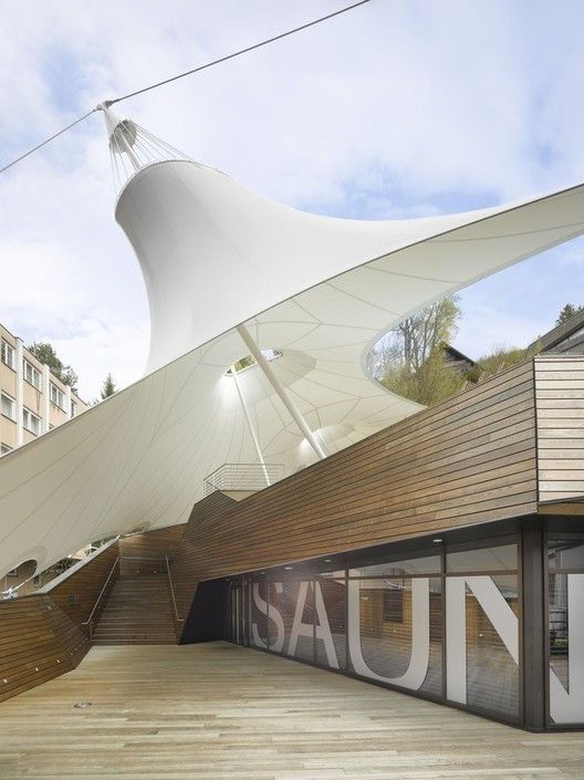 a large white structure sitting on the side of a building