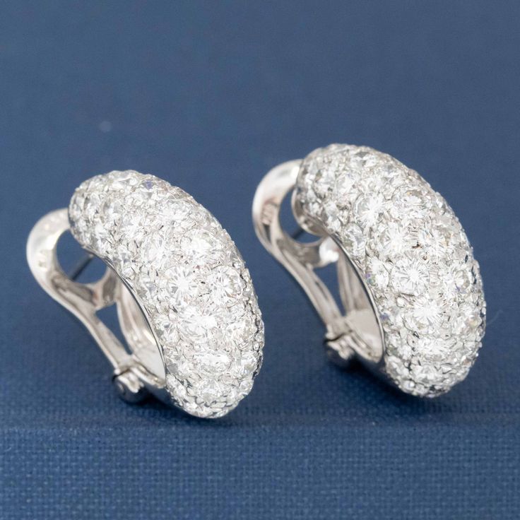 Who doesn't need huggie earrings studded with over 7cts of diamonds? I'm certainly raising my hand! This pair is both sexy and elegant at the same time, and sits on the lobes beautifully. A wonderful addition to any jewelry wardrobe, going beautifully from day to night. 18kt white gold Diamonds are estimated to be G/H colors & VS/SI1 clarities. GIA Standards Please see qualtiative report for more information. Luxury Diamond Hoop Earrings With Pave Setting, Luxury Huggie Earrings With Pave Setting In Cubic Zirconia, Luxury Huggie Hoop Earrings With Pave Setting, Luxury Diamond Huggie Earrings With Pave Setting, Luxury Hand Set Round Diamond Earrings, Luxury Diamond Huggie Earrings In Diamond White, Luxury Hoop Diamond Earrings With Single Cut, Luxury Pave Setting White Gold Huggie Earrings, Luxury Diamond White Diamond Huggie Earrings