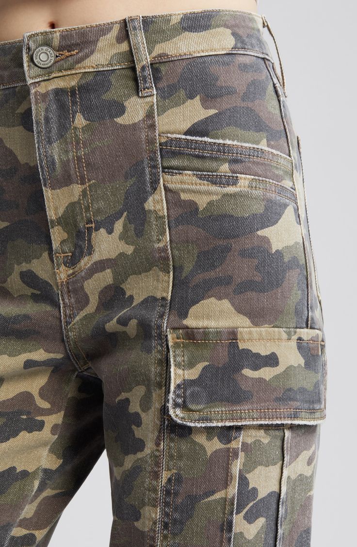 Cut from a camo-print cotton blend in a relaxed fit, these cargo pants exude laid-back, retro-cool style. 31" inseam; 11" front rise Zip fly with button closure Front slant pockets; back patch pockets; cargo flap-patch pockets 94% cotton, 5% polyester, 1% spandex Machine wash, tumble dry Imported Military Straight Leg Jeans With Cargo Pockets, Military Cargo Style Camouflage Jeans, Military Camouflage Cargo Jeans, Camouflage Military Cargo Jeans, Camouflage Straight Leg Utility Cargo Pants, Camouflage Straight Leg Cotton Cargo Jeans, Military Camouflage Jeans With Cargo Pockets, Utility Camouflage Cargo Jeans, Camouflage Straight Leg Cargo Pants