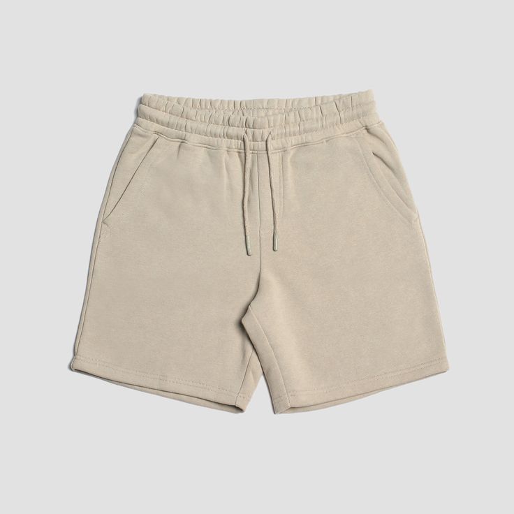 Welcome to elevated comfort. If you're a fan of our Seeker Volley, you're going to love the Loftloom Sweat Shorts! We've taken the same perfect fit from our most popular short and crafted them with a premium lofty brushed fleece that is heavyweight, warm & crazy comfortable. Our Loftloom material is made from 60% Cotton & 40% recycled polyester and fits perfectly to maximize days meant for lounging. The Details: Material: 60% Coton 40% Polyester Sustainably Sourced 17" Length Silicone Di Cotton Mid-thigh Length Shorts In Solid Color, Comfortable Beige Cotton Shorts, Comfortable Relaxed Fit Athletic Shorts, Relaxed Fit Comfortable Athletic Shorts, Relaxed Fit Athletic Shorts For Everyday, Comfortable Shorts With Elastic Waistband For Everyday, Everyday Athletic Shorts With Elastic Waistband, Cotton Mid-thigh Shorts For Loungewear, Cotton Mid-thigh Length Shorts For Loungewear