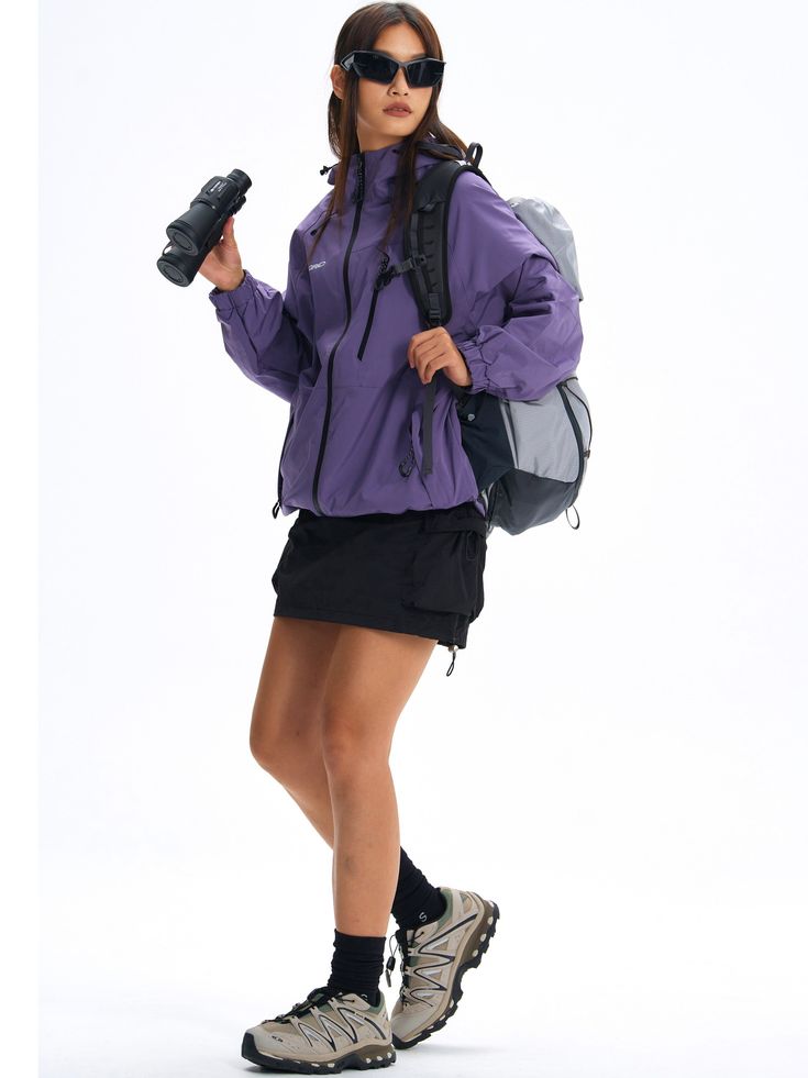 Crafted for hiking and mountain exploration, the Blade Tech® Rain Jacket combines functionality with advanced Teflon® coated nylon fabric for superior water, oil, and stain resistance. The multi-directional adjustable hood and hem ensure a perfect fit. Concealed YKK zip pockets, including a chest pocket for quick access and larger storage capacity. Logo prints on the front and back, finished with signature GRKC garment labels. Teflon® Coated Fabric Water, Oil, and Stain-Resistant Multi-Directional Adjustable Hood Concealed YKK Zip Pockets Slightly Oversized Fit Part of the GRKC® Utility Performance Series. Model Eric is 177cm / 5'10" tall and wearing size L Model Kori is 168cm / 5'6" tall and wearing size L *Please allow up to 2 weeks for processing and shipment. Technical Nylon Windbreaker With Detachable Hood, Hooded Techwear Outerwear For Adventure, Hooded Windbreaker With Adjustable Hood For Travel, Sporty Nylon Parka With Detachable Hood, Sporty Travel Windbreaker With Drawstring Hood, Sporty Nylon Outerwear For Travel, Sporty Nylon Raincoat For Travel, Travel Windbreaker With Adjustable Hood, Sports Windbreaker With Adjustable Hood