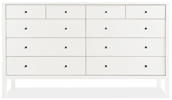 a white dresser with black dots on the drawers