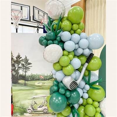 the balloon arch is decorated with green, white and blue balloons that are attached to golf tees