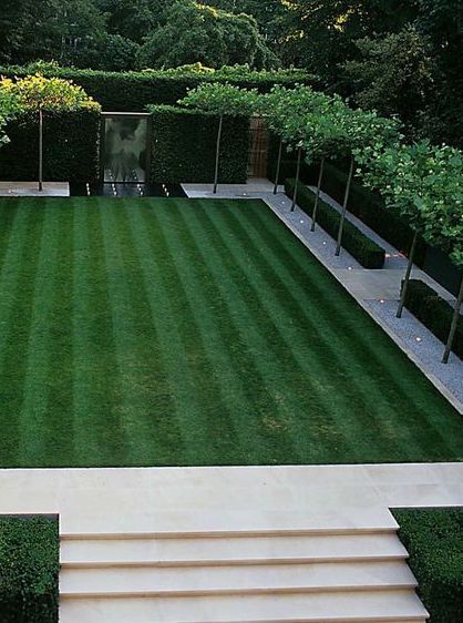 an aerial view of a garden with steps leading up to the lawn