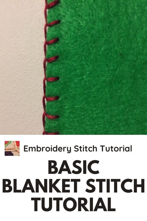 the back side of a green blanket with red stitching on it and text that reads,