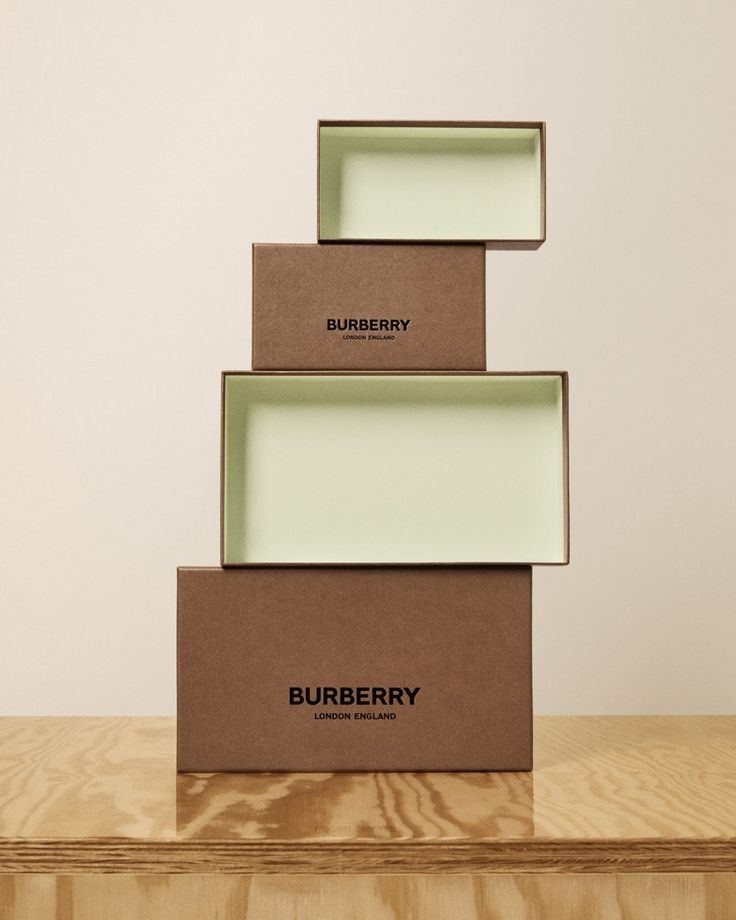 three boxes stacked on top of each other with the words burberry printed on them