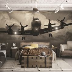 an airplane is flying in the sky above a bed and suitcases on the floor