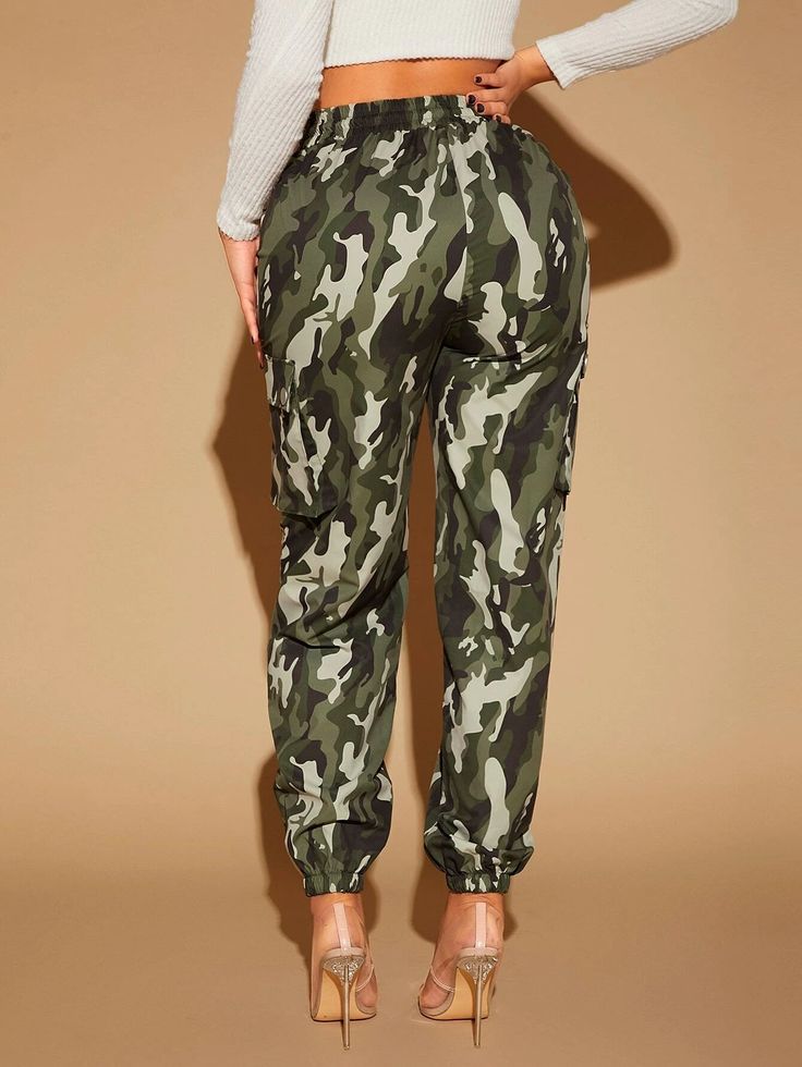 Unleash your inner adventurer with our Camo Print Flap Pocket Cargo Pants. These pants feature a stylish camo print that adds a rugged and military-inspired vibe to your look. The flap pockets provide convenient storage while enhancing the overall aesthetic. Crafted with precision and using high-quality materials, these cargo pants ensure durability and a comfortable fit. Embrace the spirit of adventure with these fashionable and practical cargo pants. Details: Waist Line: High Waist Composition Khaki Sweatpants With Pockets For Outdoor, Camouflage Cargo Pants For Fall, Khaki Cargo Pocket Joggers, Combat Cargo Pants For Outdoor, Casual Camouflage Pants With Hip Pockets, Fall Camouflage Cargo Bottoms, Military Bottoms With Side Pockets For Fall, Military Style Bottoms With Side Pockets For Fall, Fall Military Bottoms With Side Pockets