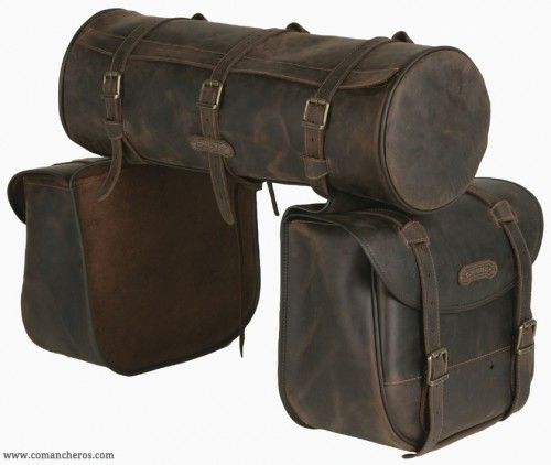 two brown leather bags sitting next to each other