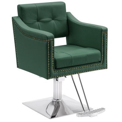 a green chair with studded trimmings on the arms and legs is shown in front of a white background