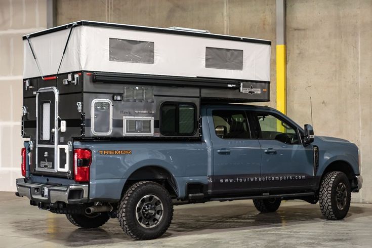 a truck with a camper attached to the back