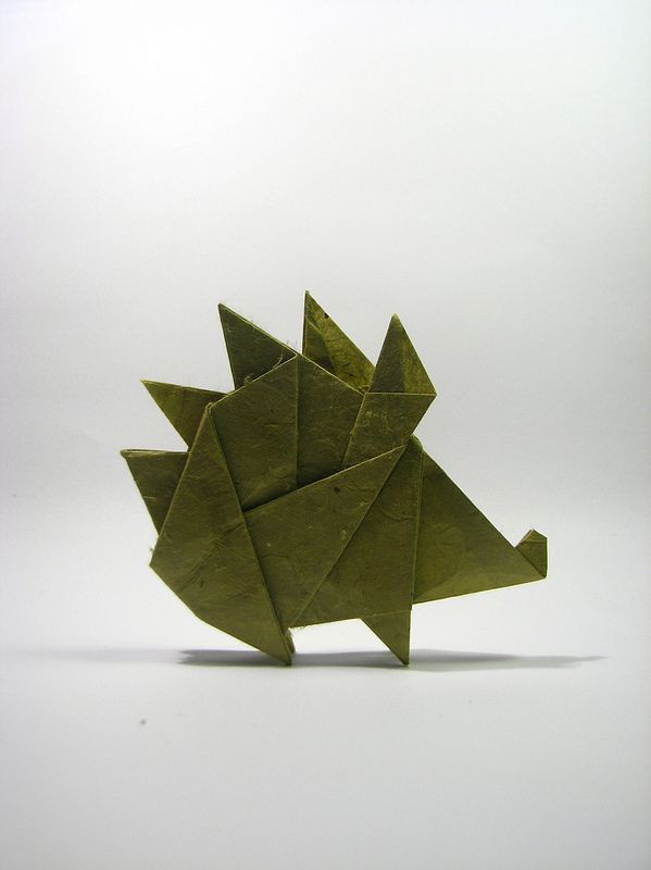 an origami hedgehog made out of green paper