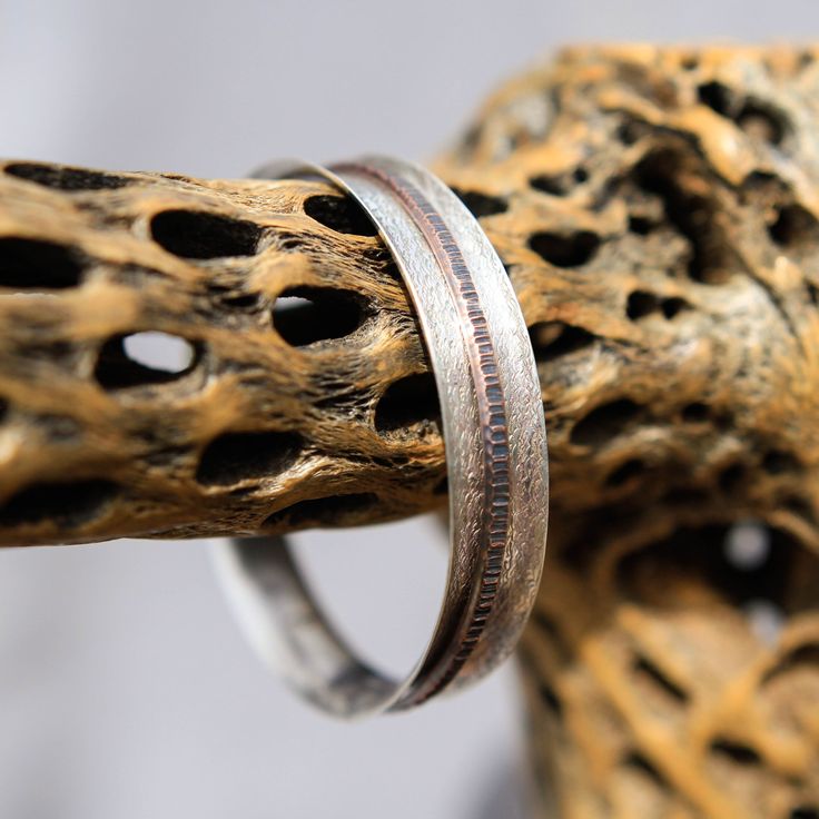 One of a kind! Custom shaped Sterling Silver Spinner Bangle Bracelet hand crafted high in the mountains of Northern New Mexico by local silversmith and lapidary artist Michael Silberhorn. Base is Sterling Silver with one (1) Copper spinner that moves freely inside ... Inspired by the spinner rings. I hand form, hand texture and silversmith all the materials for a truly unique piece of art! All metals have a hand applied patina finish for a truly antique Southwest feel. This item is one of a kind Handmade Sterling Silver Bangle For Anniversary, Handmade Artisan Sterling Silver Bangle Bracelet, Artisan Polished Bangle Jewelry, Unique Hand Forged Bangle Jewelry, Artisan Hand Forged Bangle Jewelry, Rustic Silver Bracelets For Gifts, Rustic Silver Bracelet For Gift, Handmade Rustic Bangle Jewelry, Rustic Handmade Bangle Jewelry