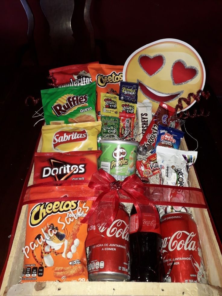 a wooden box filled with snacks and candy