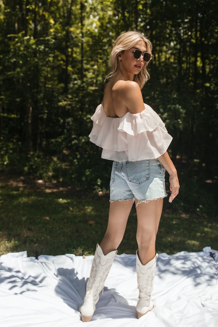 Our Elle Ruffle Top features ruffled tiered detail and an off-the-shoulder design. True to Size 100% Polyester Hand Wash Cold, Hang Dry Feminine Off-shoulder Top With Ruffles For Summer, Spring Off-shoulder Ruffle Top, Chic Ruffled Off-shoulder Top For Day Out, Off-shoulder Top With Ruffles For Brunch, Summer Off-shoulder Top With Ruffle Hem, Feminine Off-shoulder Top With Ruffles For Day Out, Pink Off-shoulder Top For Summer Day Out, Feminine Pink Off-shoulder Top For Summer, Off-shoulder Top With Ruffle Hem For Summer