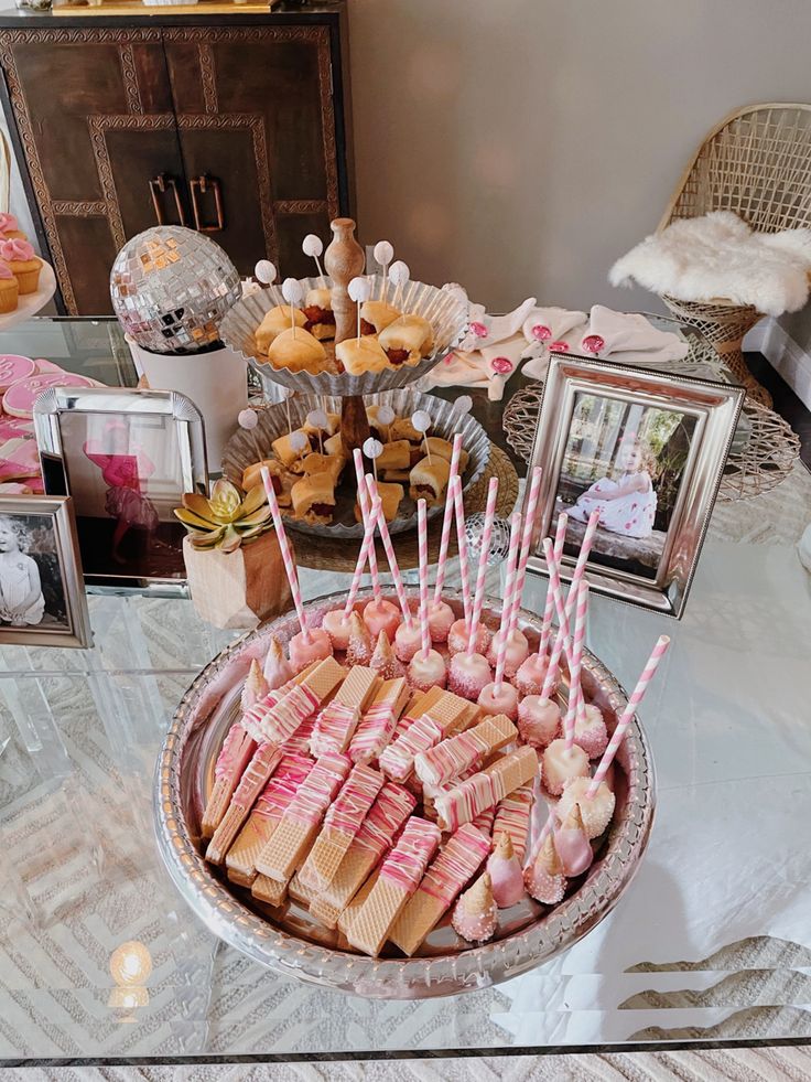 a table topped with desserts and candies