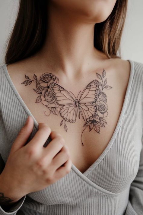 a woman with a butterfly tattoo on her chest is looking at the camera while holding onto her hand