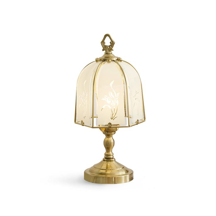 an antique style lamp with a glass shade on it's base and gold trim