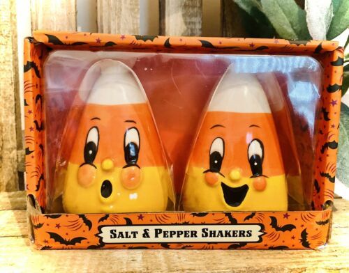 two salt and pepper shakers sitting in a box