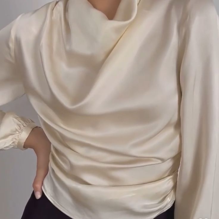 Viscose Elegant Draped Fall Blouse, Elegant Draped Tops, Chic Cream Satin Top, Cream Satin Tops For Formal Occasions, Cream Satin Top For Formal Occasions, Elegant Formal Blouse With Ruched Details, Formal Cream Satin Top, Elegant Cream Satin Top, Elegant White Ruched Blouse