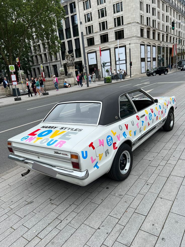 a white car with letters painted on it