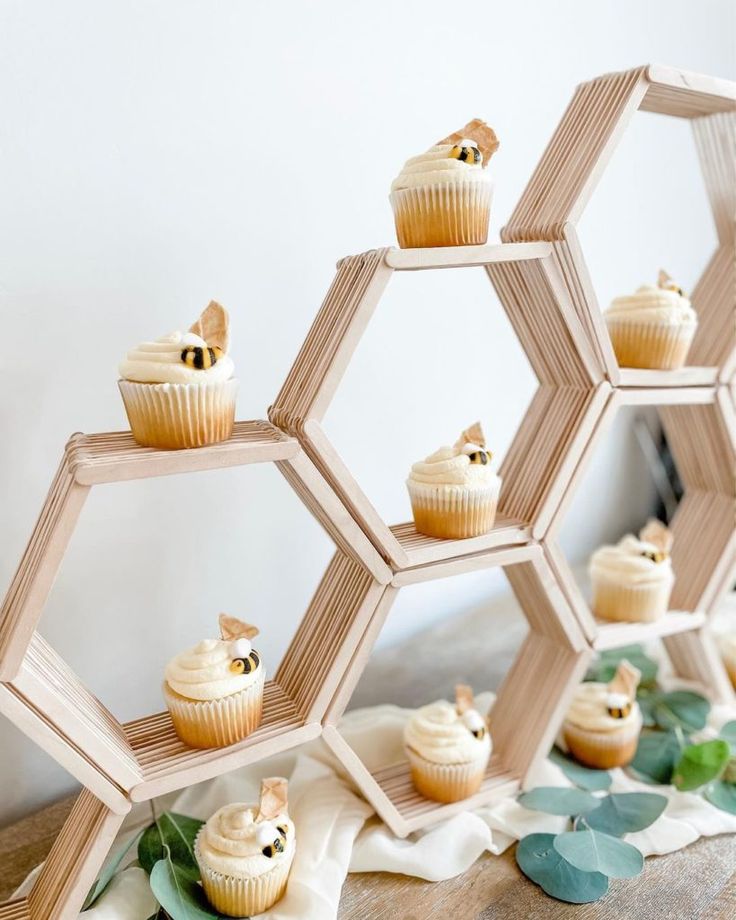 cupcakes are arranged in hexagonal sections on a table