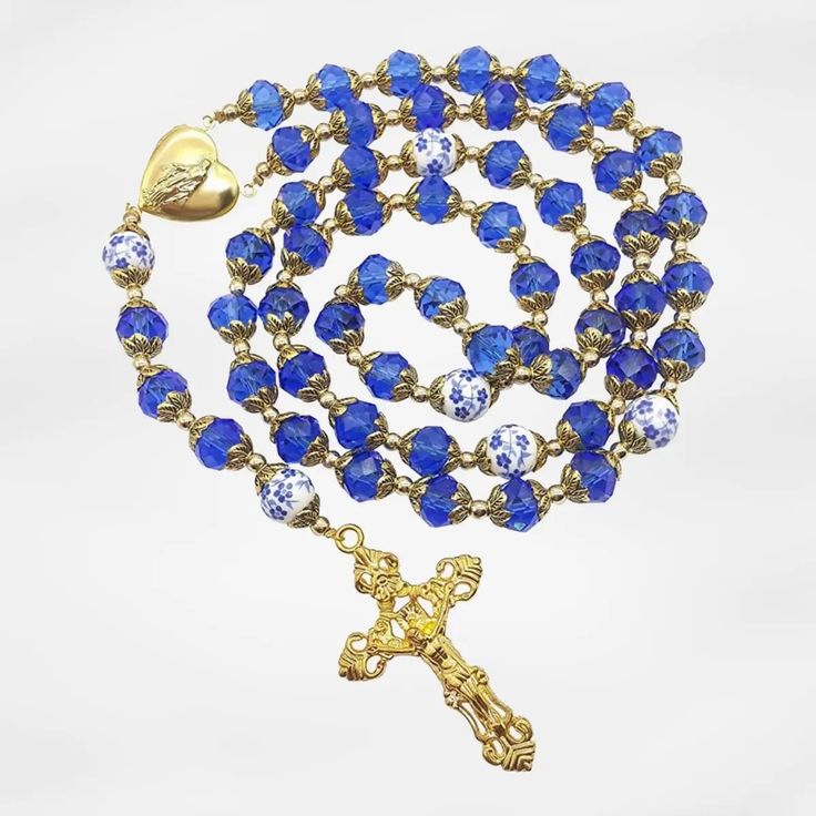 Gold Blue Crystal Rosary Crystallized Beads Necklace Miraculous Locket Medal Nazareth Store Blue Spiritual Necklace With Faceted Beads, Spiritual Blue Faceted Bead Necklaces, Spiritual Blue Necklace With Faceted Beads, Spiritual Blue Faceted Beads Necklace, Blue Spiritual Necklaces With Large Beads, Spiritual Blue Necklaces With Large Beads, Spiritual Blue Necklaces With Polished Beads, Royal Blue Round Beads Necklace For Gift, Blue Necklaces With Large Beads For Gift