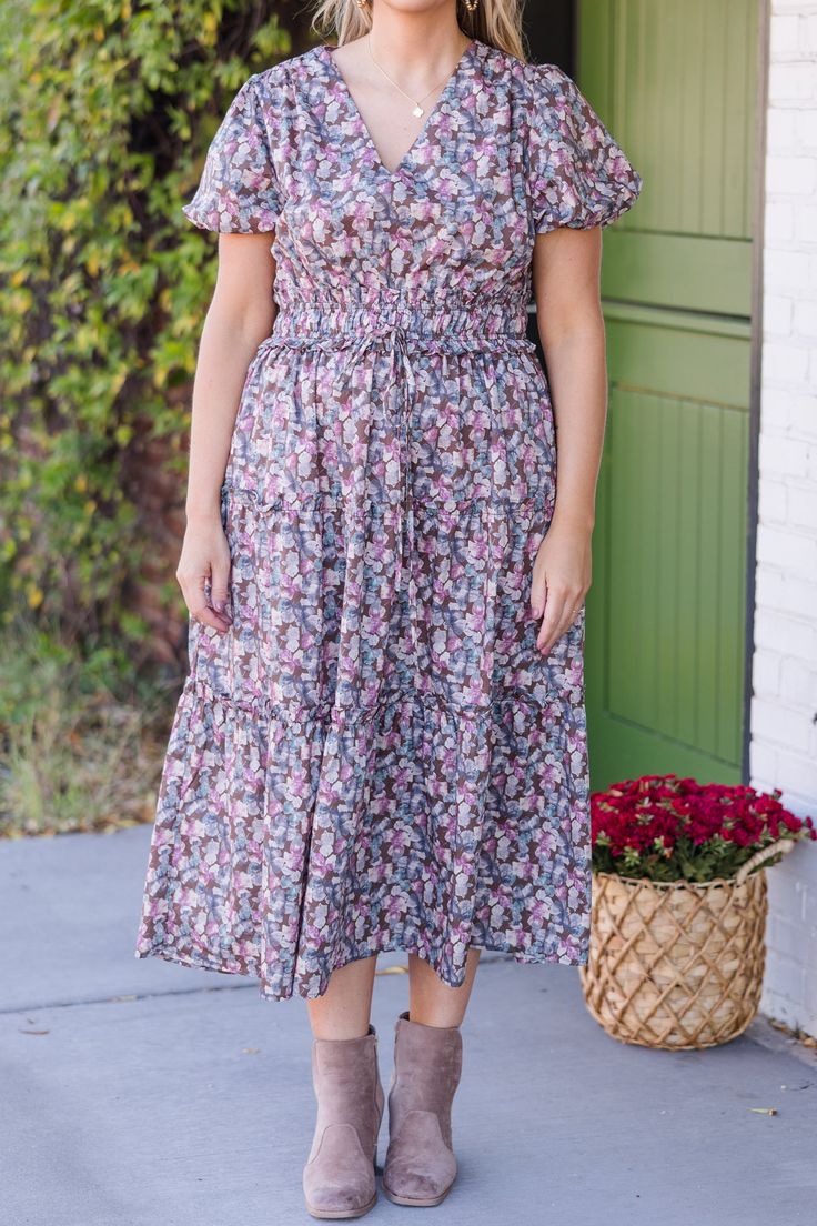 Get ready to turn heads in this dress! This midi-length dress features delicate puff sleeves, a flattering neckline, and a smocked waistband for a feminine silhouette! Its tiered skirt and beautiful floral print will have you feeling elegant and stylish! Perfect for every occasion! Body - 100% Cotton Contrast - 100% Polyester Ruched Short Sleeve Smocked Dress For Garden Party, Short Sleeve Ruched Smocked Dress For Garden Party, Spring Midi-length Peasant Dress With Smocked Back, Midi Dress With Gathered Sleeves For Garden Party, Spring Midi Peasant Dress With Smocked Bodice, Modest Floral Print Dress With Puff Sleeves, Garden Party Puff Sleeve Midi Dress With Gathered Neckline, Casual Puff Sleeve Midi Dress With Smocked Bodice, Billowy Midi Dress With Smocked Back