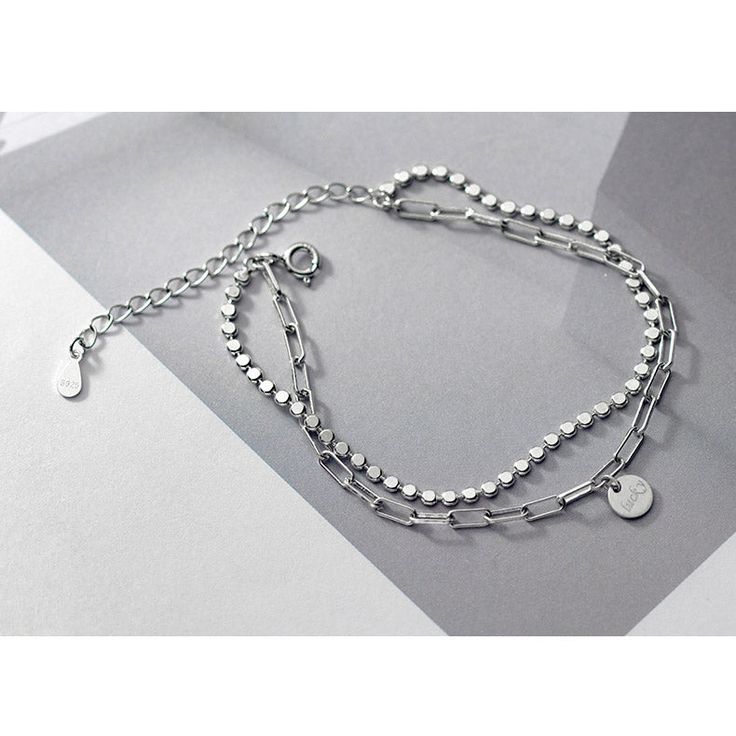 This Double Chain Disk Bracelet is a modern style bracelet with anti-allergic and durable finish that makes it blend with any outfit. Trendy Sterling Silver Chain Bracelet, Adjustable Silver Chain Link Bracelets, Minimalist Silver Alloy Bracelets, Minimalist Silver Metal Charm Bracelet, Trendy Stainless Steel Box Chain Bracelets, Modern Silver Double Chain Bracelet, Trendy Everyday Sterling Silver Bracelet, Trendy Stainless Steel Box Chain Bracelet, Minimalist Metal Charm Bracelet With Adjustable Chain