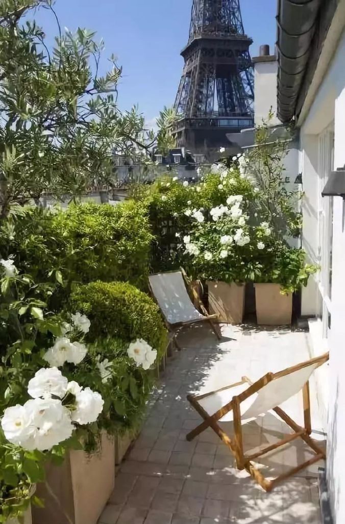 the view of the eiffel tower from an apartment balcony