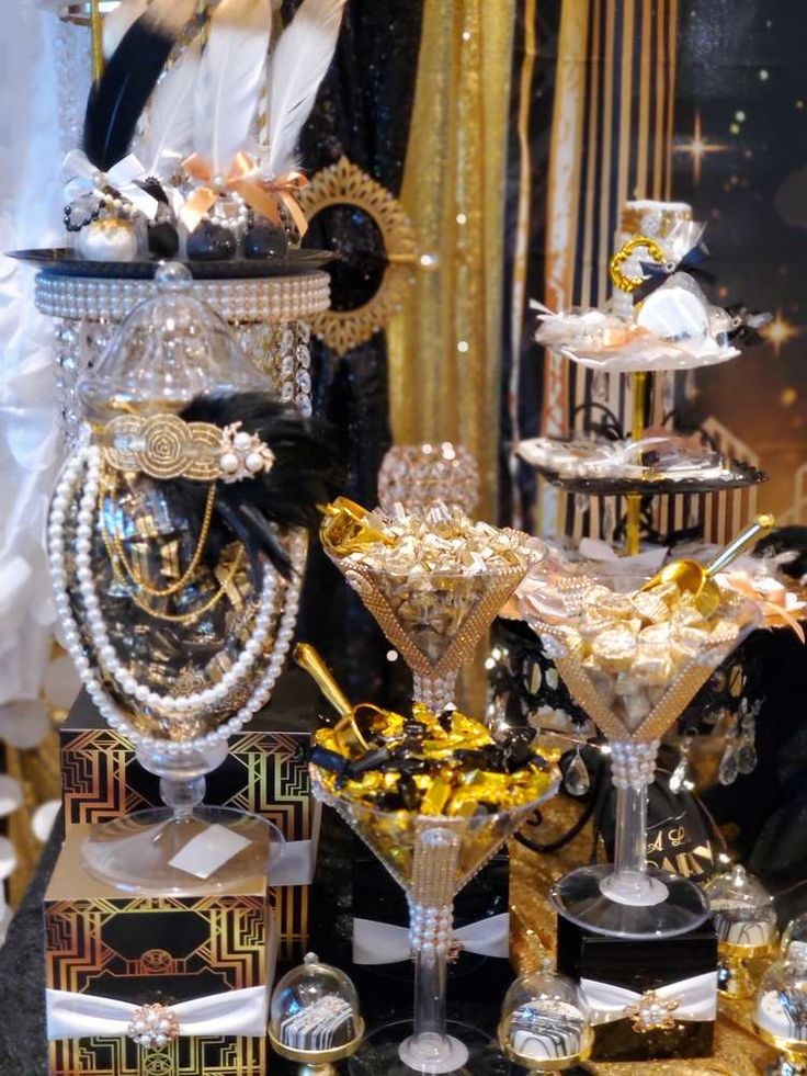 a table topped with lots of different types of jewelry and cakes on top of each other