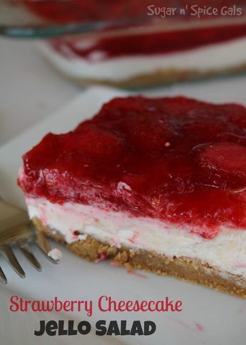 strawberry cheesecake jello salad on a plate with a fork