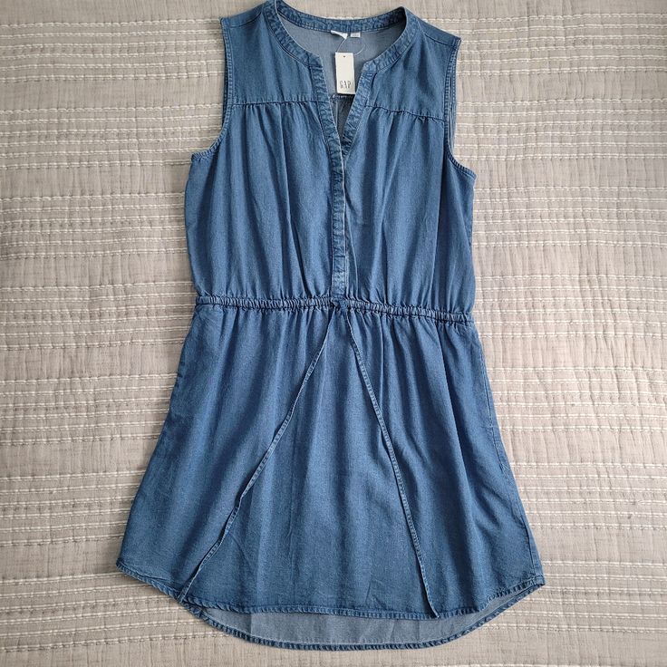 A Tencel Sleeveless Dress With A Drawstring Waist From Gap. Size Large. New With Tags, Never Worn. It Was A Bit Baggy On Top, So I Ordered A Size Down. Very Comfortable And Breezy. Good For Summer Or Cooler Fall Weather With A Sweater. Casual Blue Sleeveless Dress, Gap Sleeveless Sundress For Spring, Gap Sleeveless Cotton Dress, Gap Summer Sundress, Gap Sleeveless Casual Sundress, Casual Sleeveless Sundress By Gap, Sleeveless Cotton Dress By Gap, Casual Blue Sleeveless Dress For Day Out, Casual Cotton Mini Dress By Gap