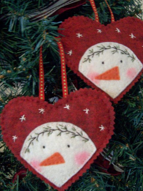 two snowman ornaments hanging from a christmas tree with the caption saved by aldye minano