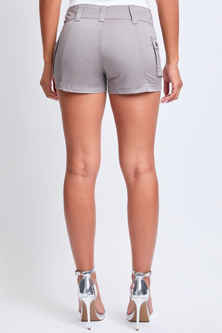 Get it poppin’ in poplin! Our Women’s Low Rise Poplin Cargo Shorts will have you ahead of the trend and ready for any adventure. This low-waisted short is slightly stretchy and features side cargo pockets that accentuate your hips and a front metal d-ring detail. Wear with a mini graphic tee and sneakers for an athleisure vibe, or a cropped tank with heeled sandals for a nighttime look. Product Details:- Low-Rise- Double Button Closure with Zipper - Cargo Pockets with Double Snap Button - Belt LoopsSize & Fit (Based on size 5)- Inseam: 3”- Rise: 9”- Leg Opening: 23.5”- Model is wearing a size 3Machine wash cold, separately and inside out. Tumble dry low. 98% Cotton/ 2% Spandex (Color: Green Tea, Black, Taupe) Spring Sporty Cargo Shorts, Sporty Cargo Style Shorts For Summer, Stretch Cargo Shorts With Pockets For Summer, Sporty Summer Cargo Bottoms, Stretch Summer Shorts With Cargo Pockets, Summer Stretch Cargo Shorts, Nylon Cargo Shorts For Summer, Short Nylon Bottoms With Side Pockets, Nylon Bottoms With Side Pockets And Short Shape