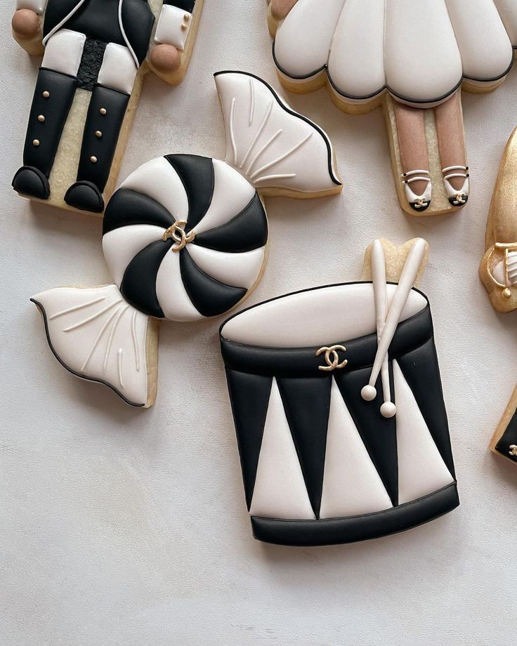 decorated cookies in the shape of women's shoes and purses