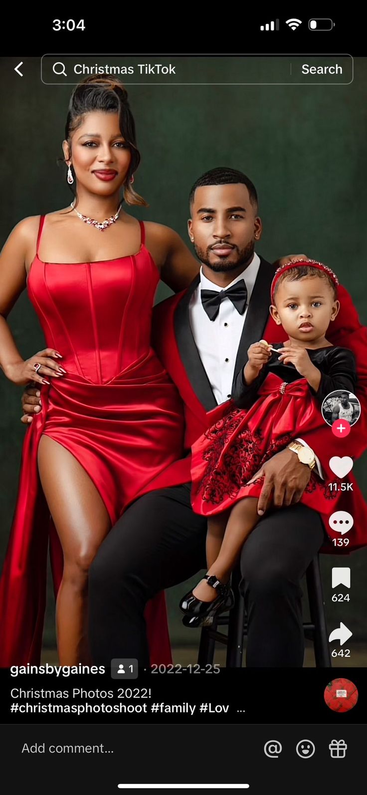 a man and woman posing for a photo with a baby