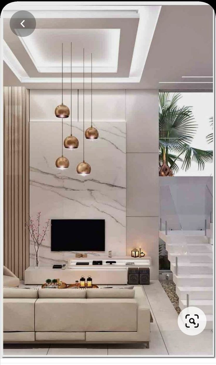 a modern living room with marble walls and white steps leading up to the second floor