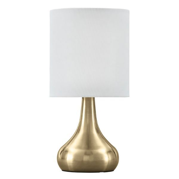 a gold table lamp with a white shade